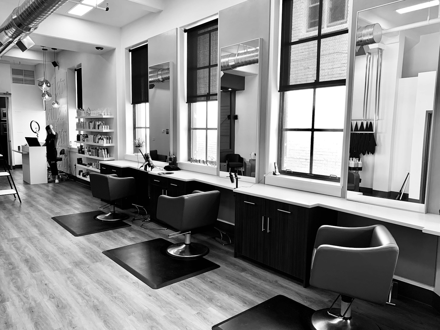 Illustrative bright salon interior with styling chairs
